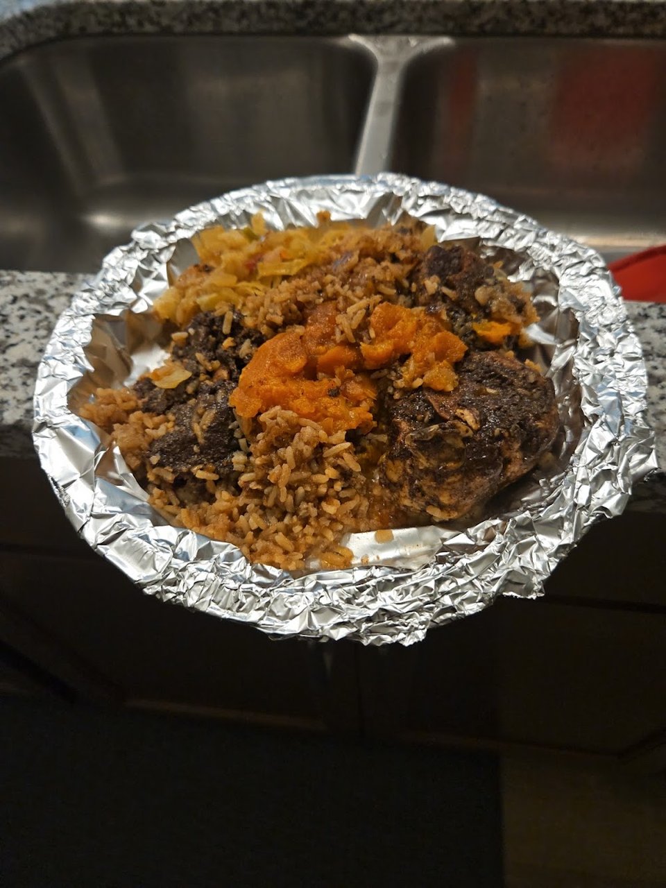 Restaurant menu showing Jamaican dishes and sides.